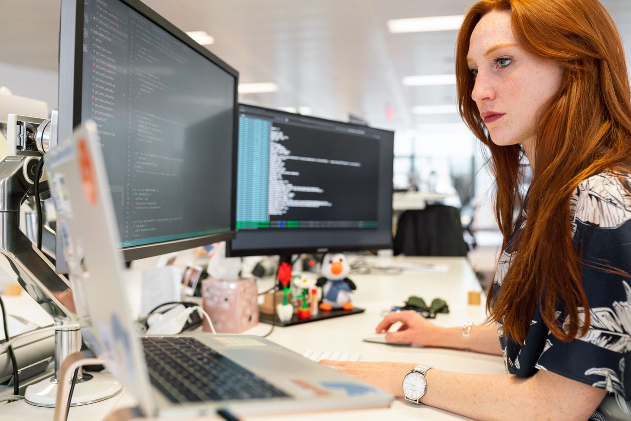 Developer writing code at a computer
